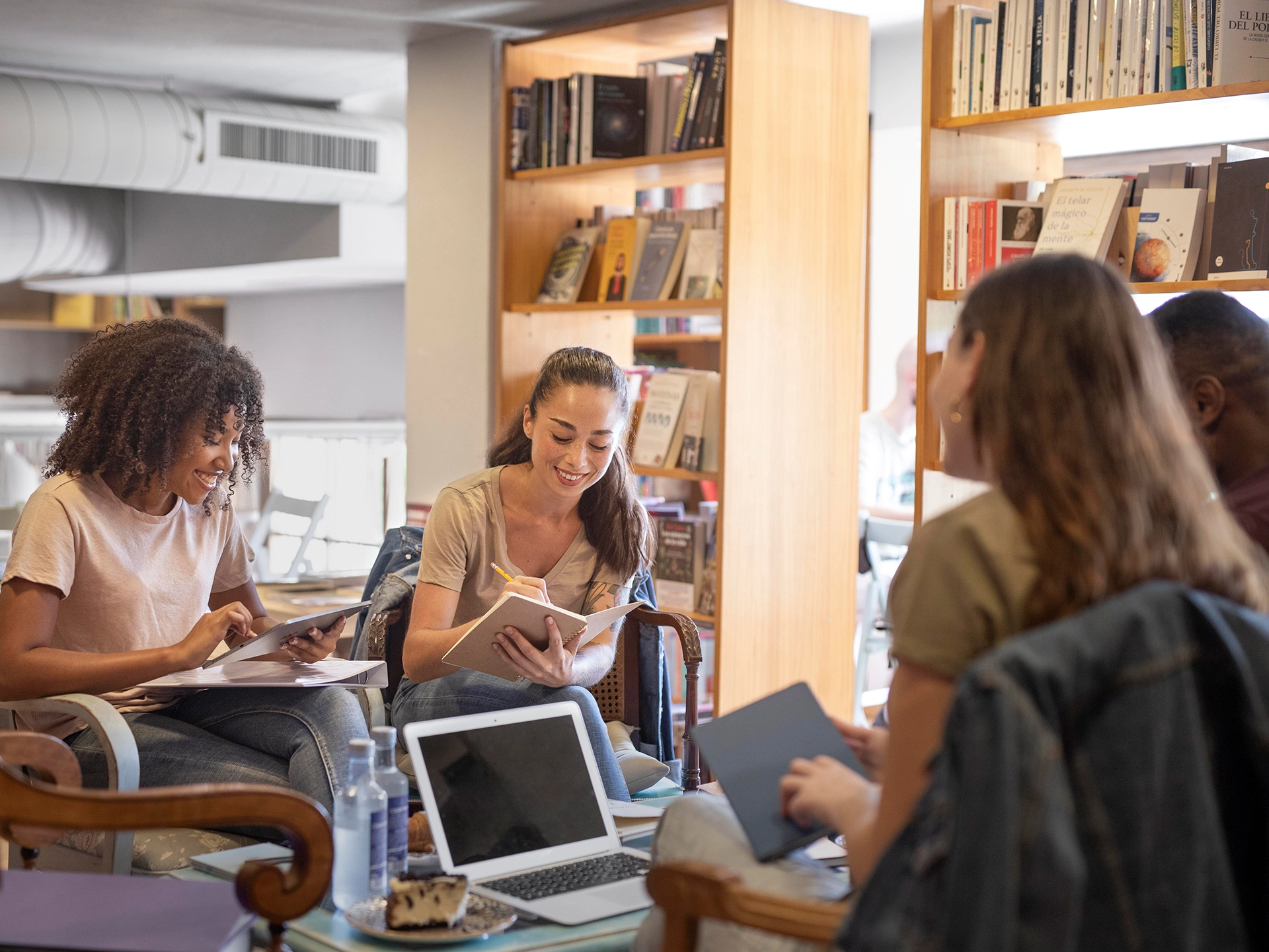 Higher education students studying in university library
